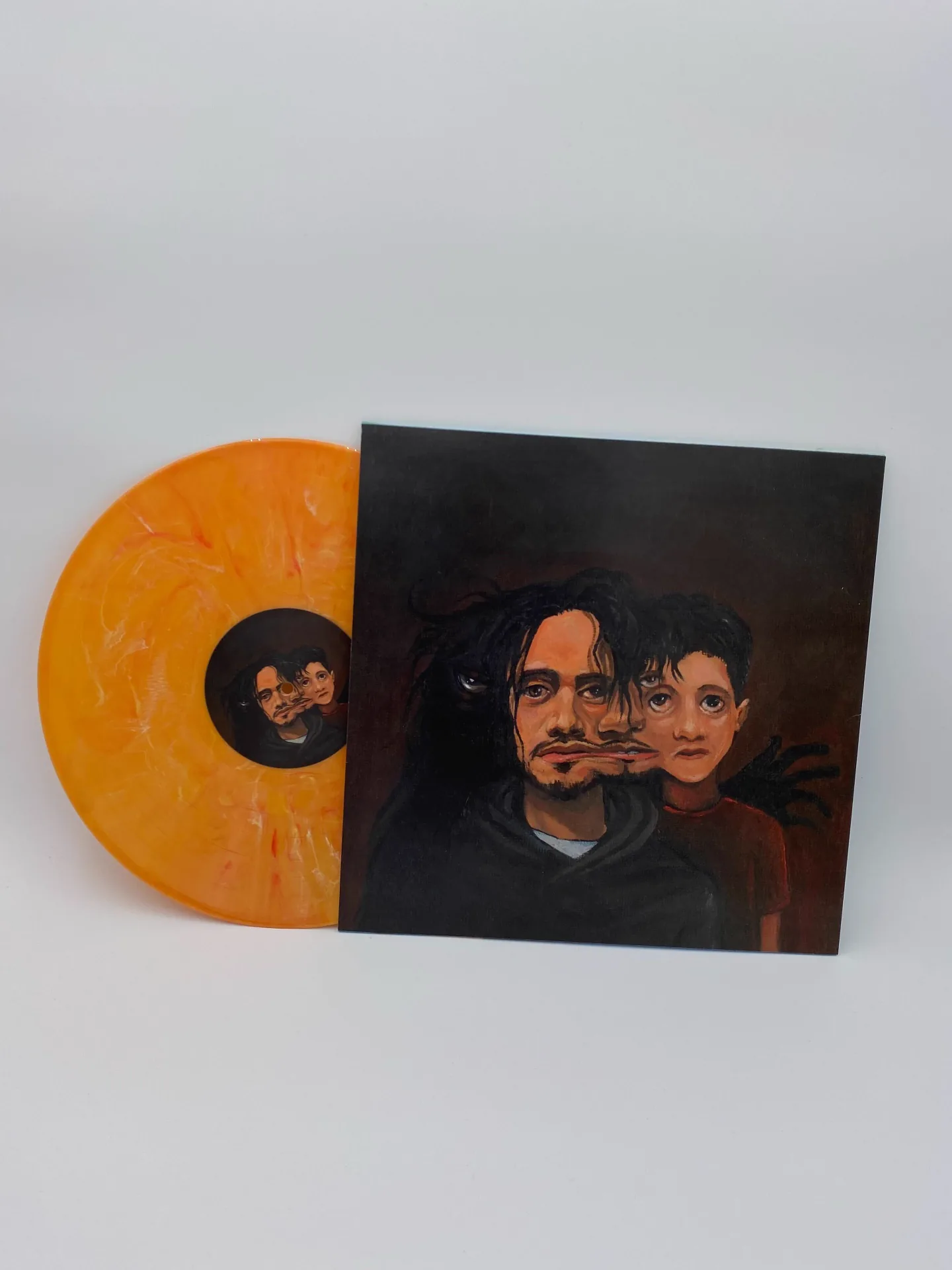 Orange marble vinyl with hand-painted portrait jacket pressed by Unified Artist Services