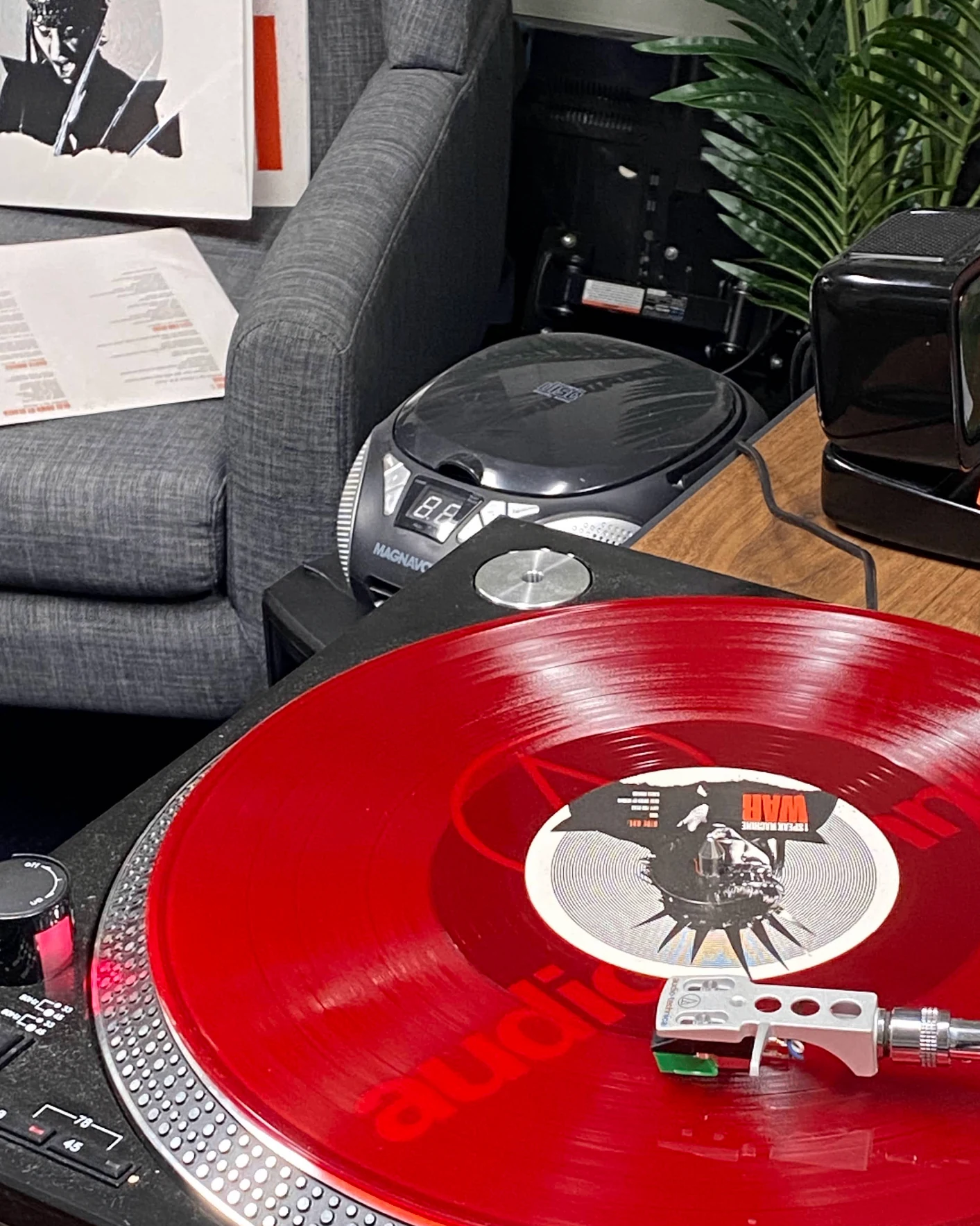 Red vinyl spinning on an Audio-Technica turntable — Unified Artist Services pressing