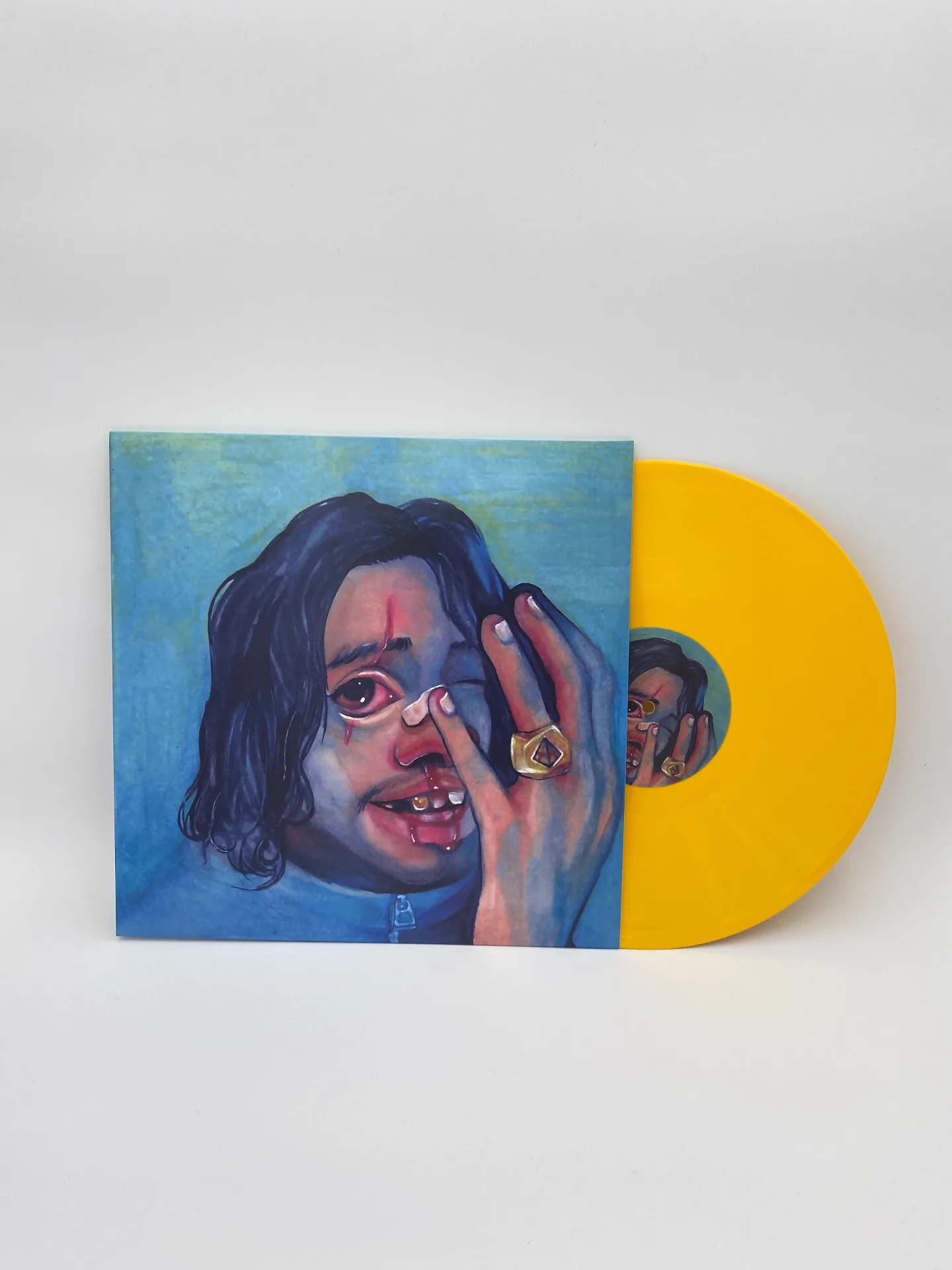 Translucent yellow 12-inch vinyl with blue painted portrait jacket